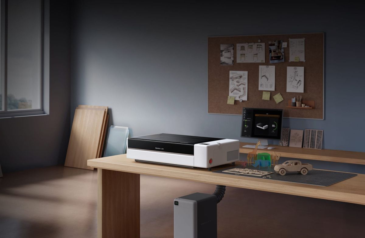 Bambu Lab's R1 laser cutter and engraver on a workshop bench in the manufacturer's announcement image