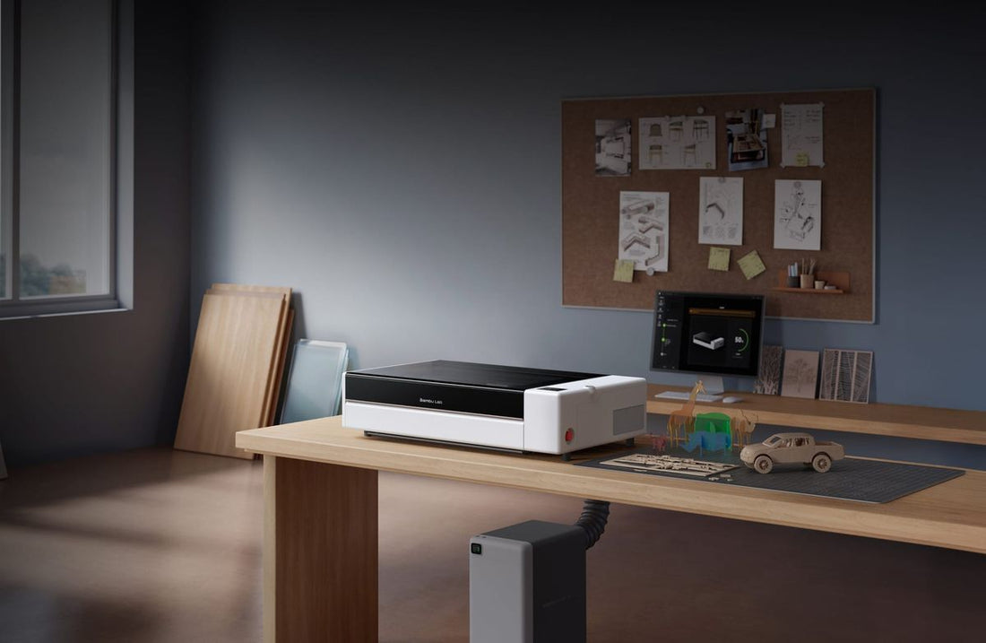 Bambu Lab's R1 laser cutter and engraver on a workshop bench in the manufacturer's announcement image